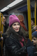 © Antonio Recena - Attractive Forty Year Old Woman Wearing a Winter Hat Traveling Standing on the City Metro