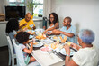 © Nexa - Multi-generational Black family enjoying a healthy breakfast together at a dining table in a bright kitchen.