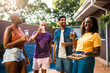© Nexa - Diverse group of happy friends enjoying a backyard pool party with beer and snacks on a sunny summer day.