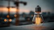 © Talenta - A lit, vintage bulb sits on a ledge with a construction backdrop