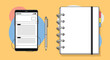 © Lily - Top view of a workspace with a smartphone, a pen, and a spiral notebook on a bright yellow background for productivity themes.