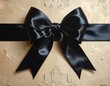 © Bvcxr - Close-up of black satin bow on textured, ornamental background