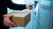 © Стивен Щиров - Person using a parcel locker to retrieve a package from a delivery service