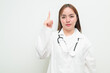 © Ranta Images - Portrait of young Asian female doctor against white background pointing finger