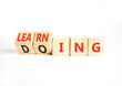 © Dzmitry - Doing or learning symbol. Concept words Doing to Learning on beautiful wooden cubes. Beautiful white table white background. Educational business doing or learning concept. Copy space
