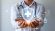 © Sultana - Health insurance concept. Medical welfare, health and access to healthcare. Person holding healthcare medicine protected guard shield on virtual screen.