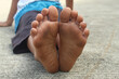 © Hendri - Close up of a child's dirty feet after playing outdoors barefoot.