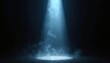 © Pete - Blue light beam cuts through dark smoky space. Stage spotlight illuminates ground. Fog swirls around bright light source. Abstract atmosphere.