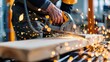 © savittree - Skilled craftsman using a jigsaw to cut wood with flying sparks in a workshop environment showcasing craftsmanship and precision