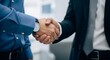 © Karmiyem - Professional Businessmen Engaging in a Formal Handshake During a Corporate Meeting or Conference for Successful Business Partnership and Collaboration