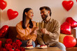 © Home-stock - Valentine's Day celebration. Spouses clinking glasses drinking wine celebrating holiday, having romantic evening at home
