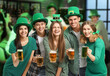 © Pixel-Shot - Friends with beer on white background. St. Patrick's Day celebration