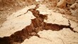 © Hendra Studio - A deep geological fault line with fractured layers of earth and dry soil showing the raw texture of the ground