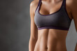 © Daniel - close-up of slim toned young woman showcasing flat stomach belly and abs, fit female body