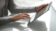 © fizkes - Office worker with touchpad. Close up hands young female sitting at desk using tablet. Online research remote communication financial project management ecommerce shopping education elearning concept