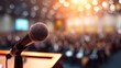 © afdal - Microphone on stage with blurred audience and warm sunlight overhead