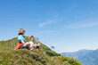 © Elena Medoks - Children relaxing on mountain top enjoying summer vacation