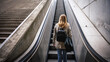 © encierro - Businesswoman going up escalator in city subway. Woman commuter in urban environment on her way to work. City life