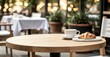 © Natalia - Coffee and croissant on wooden table in cozy café