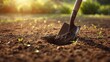 © TheWaterMeloonProjec - Planting activity involving a spade in sandy soil with weeds nearby, highlighting garden care, World Gardening Day