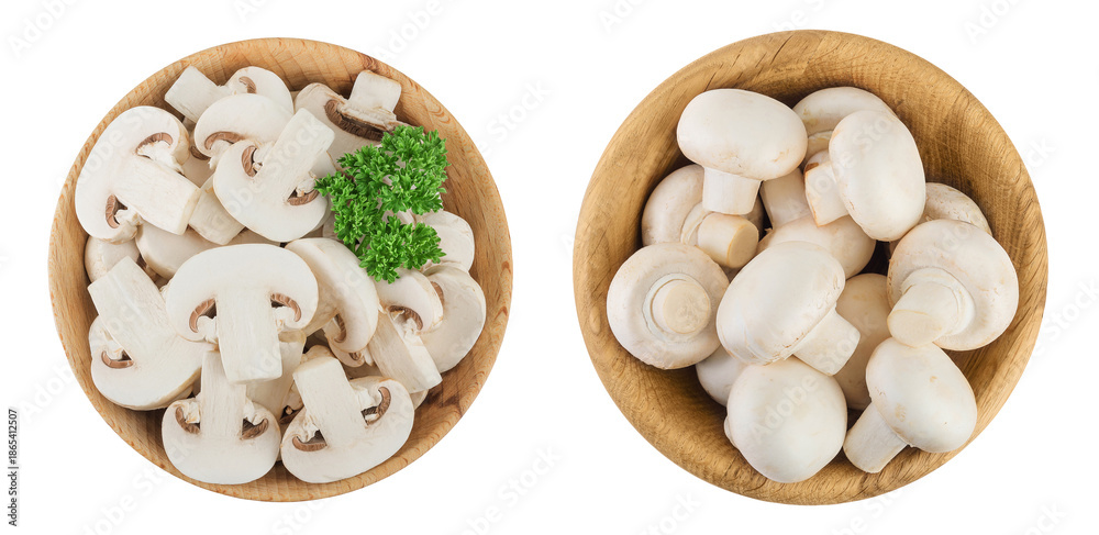 Fresh mushroom champignon slices in a wooden bowl isolated on white background. Top view. Flat lay