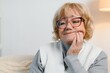 © Serhii - Senior woman suffering from toothache at home
