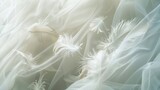Delicate white feathers floating gently above a cascade of billowy fabric.