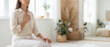 © benjamin - A serene individual, embodying inner peace and self-awareness through meditation. In a minimalist, sunlit space with soft hues of natural elements, this scene evokes tranquility and mindful living.