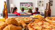 © julijadmi - Group of friends enjoying a Super Bowl watch party with delicious snacks and drinks, creating a lively and festive atmosphere for celebration