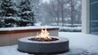 © CYBERPINK - Round fire pit in the center of a snowy landscape. the fire pit is made of concrete and is surrounded by a concrete wall. the flames are burning brightly, creating a warm and inviting atmosphere.