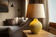 © Alona - Close-up of yellow lampshade and warm light in contemporary interior