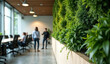 © miracle - Green office space, Interior of a office with green plants and people in the background