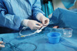 © Alla - Elimination of blood clots. Vascular endovascular surgery. Surgical interventions on blood vessels. The hand surgeon. Concept of health care.