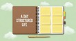 © Hana - A gold pen rests on an open notebook with yellow sticky notes, illustrating a structured day plan.