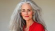 © Pricha.RT - Elegant mature woman with silver hair in a stylish red outfit