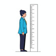 © Rahman - A person in a suit stands beside a height chart