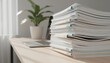© ANDREY PROFOTO - Large stack of business documents and files on modern office desk