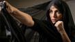 © Aalami - Strong woman in black hijab practicing martial arts with determination