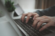 © winnievinzence - Hand typing on laptop keyboard at home office workspace. Freelancer working online, using computer for business, education, coding, and digital marketing concept. Representing work productivity,