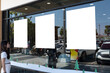 © jittawit.21 - Three Blank Poster Mockups on Storefront Window with Woman and Urban Street Reflections