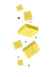 © New Africa - Bouillon cubes and peppercorns flying in air on white background