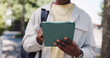 © Flash25/peopleimages.com - Man, hands and student in city with tablet, university schedule or course program information. Academic, person or outdoor with tech for research, calendar reminder or education opportunity on campus