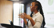 © Flash25/peopleimages.com - Presentation, speaking or woman with tech at podium, company stats or performance data review. Space, pc or African presenter with mic for info analysis, explain charts or graphs for business seminar