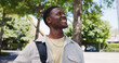 © Flash25/peopleimages.com - Black man, student and thinking on campus with smile, education opportunity and environmental study. Ecology degree, person and happy at university with perspective, academic scholarship and pride