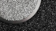 © Liu - Raw molybdenum ore crystals on black shale with metallic reflections,showcasing strategic mineral resources and clean energy materials for industrial use.