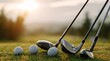 © Bagus - Golf clubs and balls on a grassy field, with a blurred natural background during sunset