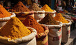 © panophotograph - A collection of colorful spices in a market. A vibrant, wide shot of a stall in a spice market
