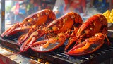 Three bright red, cooked crustaceans sit grilling. Visible steam rises from the prepared food. Background shows blurred outdoor activity and a yellow side dish