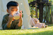 © Kunlathida - Children and fun in garden tent outdoor in nature for camping