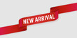 © Adobe worker  - Red ribbon banner with white text NEWARIVAL angled on white background new arrival